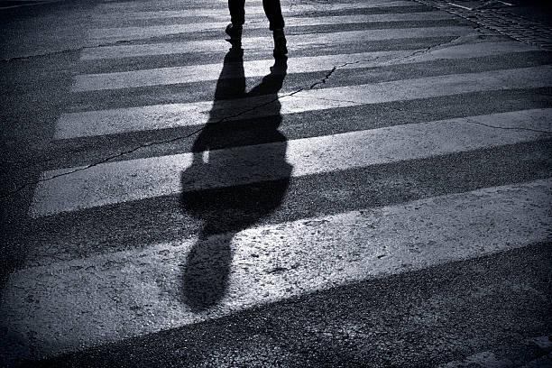 istock Pedestrian crossing with shadow in Rome, Italy 186664227