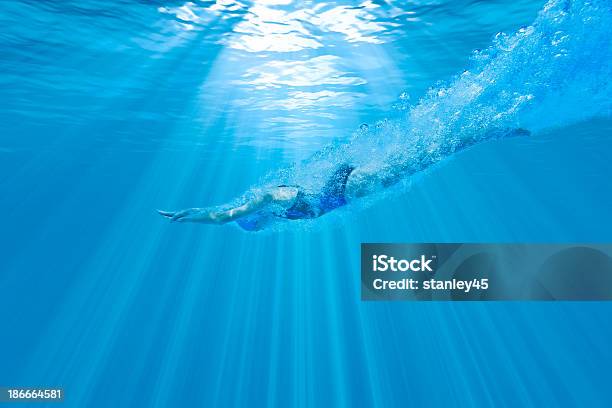 Girl Diving Underwater With Perfect Form Stock Photo - Download Image Now - Diving Into Water, Underwater Diving, Swimming Pool