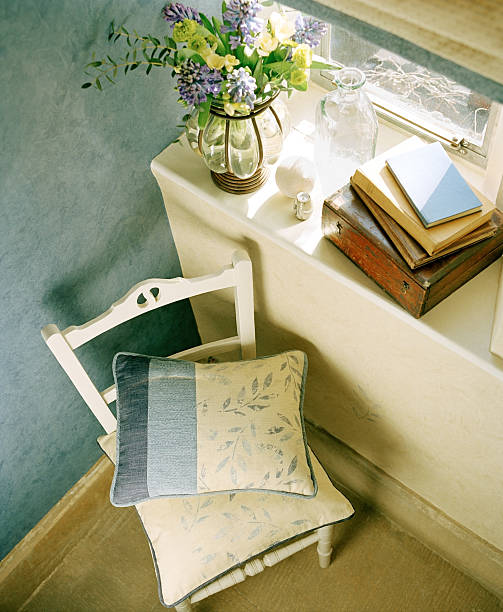 istock Books and vase by the window 186664593