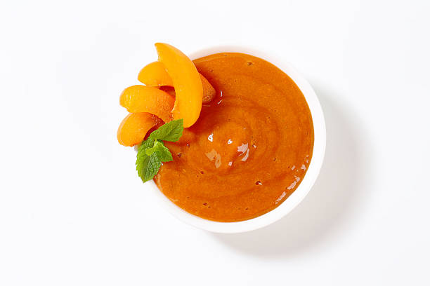 apricot-püree - peach nectarine fruit portion stock-fotos und bilder