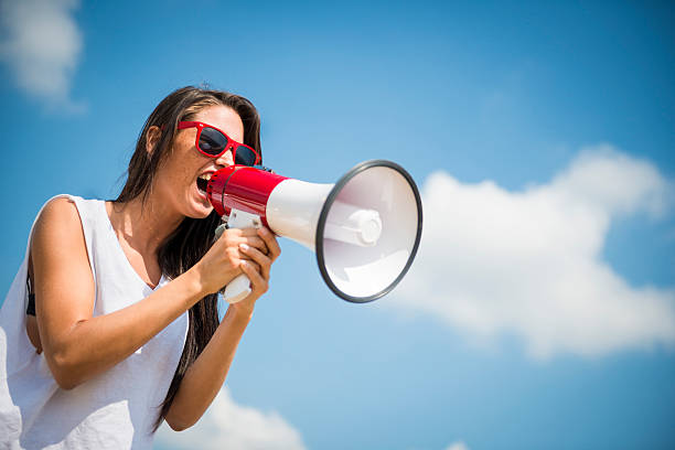 Giovane donna con Megafono - foto stock