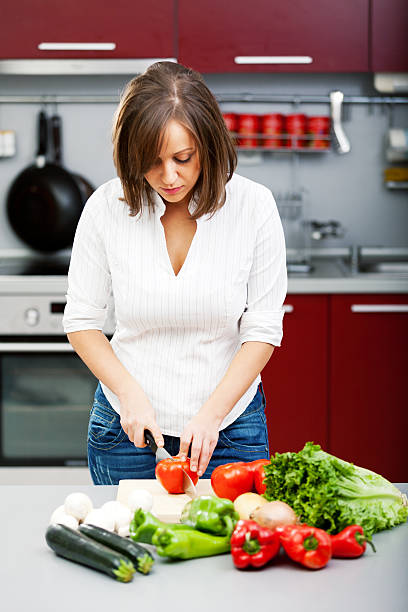 istock Young woman making salad 186667361