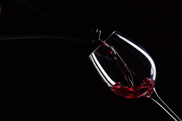 istock bottle and glass with red wine 186671050