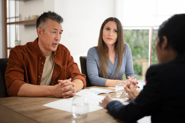 istock Couple talking with financial advisor 1866755335