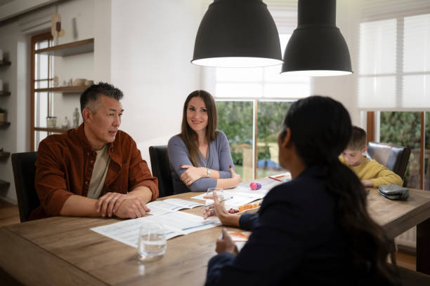 istock Couple talking with financial advisor 1866755345