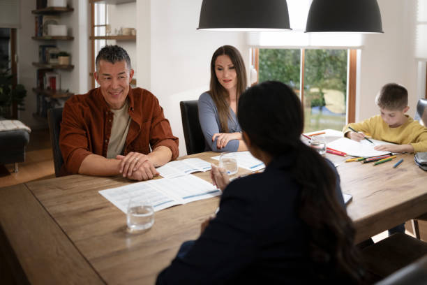 istock Couple talking with financial advisor 1866755360