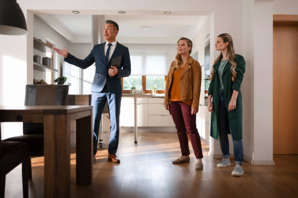 istock Real estate agent showing house to customers 1866755376