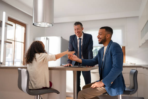 istock Real estate agent talking with family 1866755427