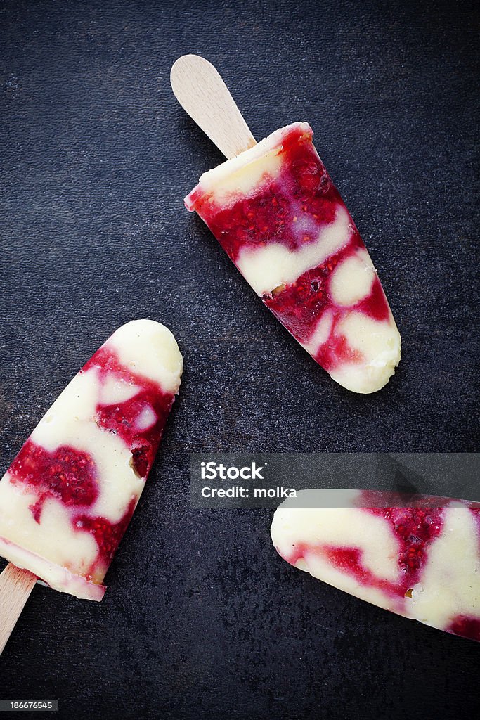 Homemade popsicles Homemade popsicles with vanilla pudding and raspberries Cream - Dairy Product Stock Photo