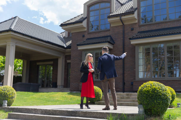 istock Property manager shows cottage residence to client 1866766814