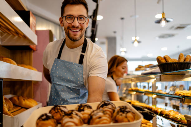 istock Male and female workers collaborating in bakery 1866768365