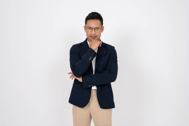 istock Confident Asian businessman is looking at the camera while standing on an isolated white background. 1866768732