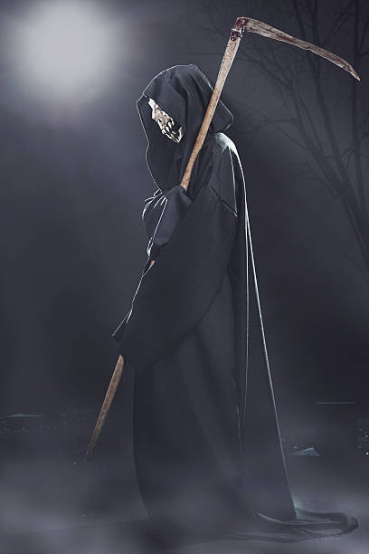 istock death with scythe standing at night 186677247
