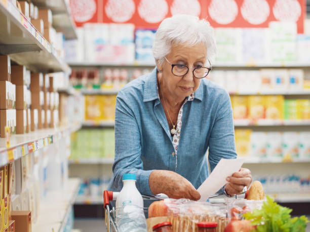 istock Disappointed senior customer checking the grocery receipt 1866772664