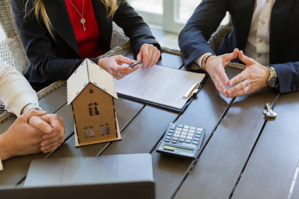 istock Estate agent shows residence and prepares contract 1866773706