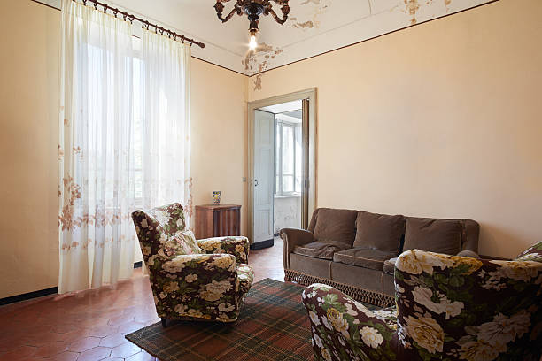 istock An old living room with a sofa and curtains 186677550