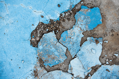 Cracked concrete wall texture pattern of color crack concrete pavement damage fractured construction background