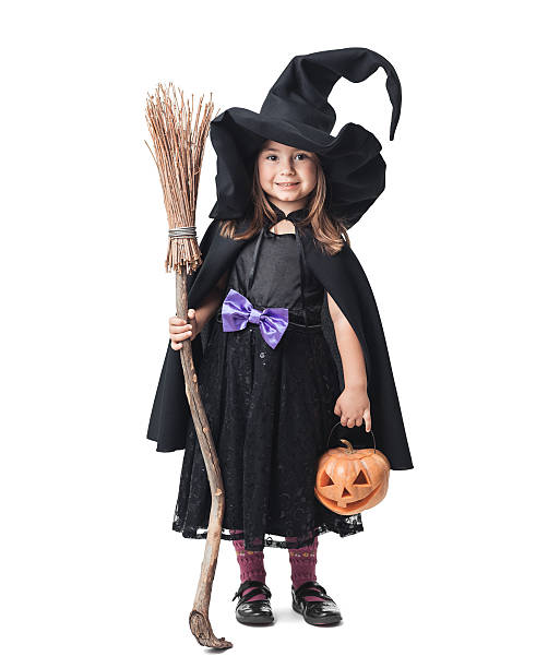 istock little witch with a broom and pumpkin 186678621