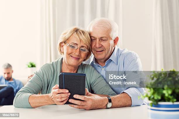 Senior Couple With Ereader Stock Photo - Download Image Now - Couple - Relationship, E-Reader, Reading