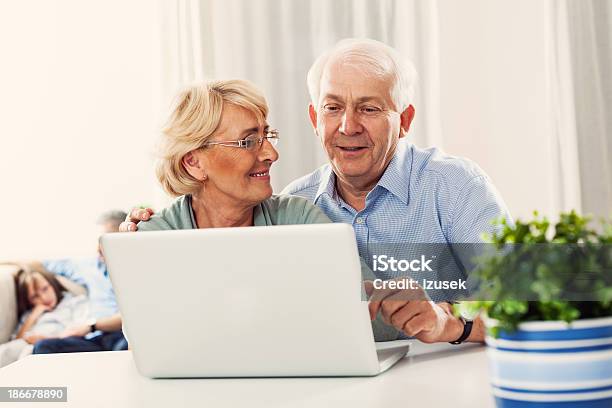 Senior Couple With Laptop Stock Photo - Download Image Now - 60-64 Years, Active Seniors, Adult