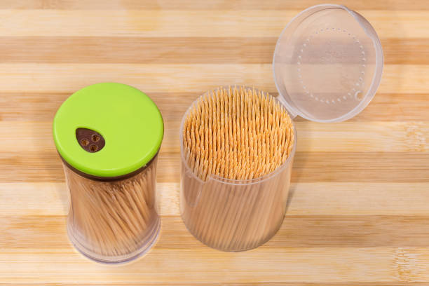 istock Bamboo toothpicks in two different plastic containers on wooden surface 1866797352