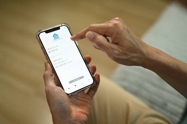 istock Closeup view man using banking app on smartphone for contactless payment and accounting 1866797862