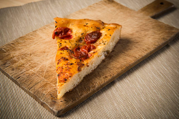 Apulian focaccia bread on cutting board stock photo