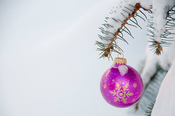istock Christmas ornament on outdoor pine tree with snow 186679884