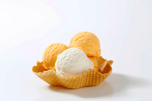 scoops of apricot and lemon ice cream in wafer bowl