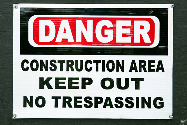 istock Danger Construction Site Warning Sign on Black Plywood 186680387