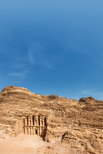 The Monastery, Petra, Jordan: The Monastery, also known as Ad Deir and also spelled ad-Dayr and el-Deir, is a monumental building carved out of sandstone in the ancient Jordanian city of Petra. The Monastery was probably carved in the mid-first century AD.