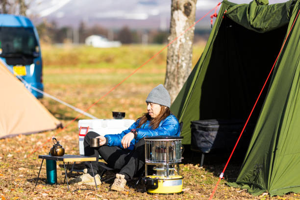 istock Man relaxing outside his tent with a morning coffee 1866829504