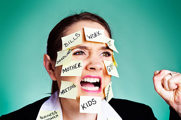istock Angry overwhelmed multitasking woman shouting and shaking fist 186683661