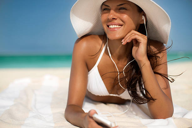 istock Lovely woman on the beach 186683680