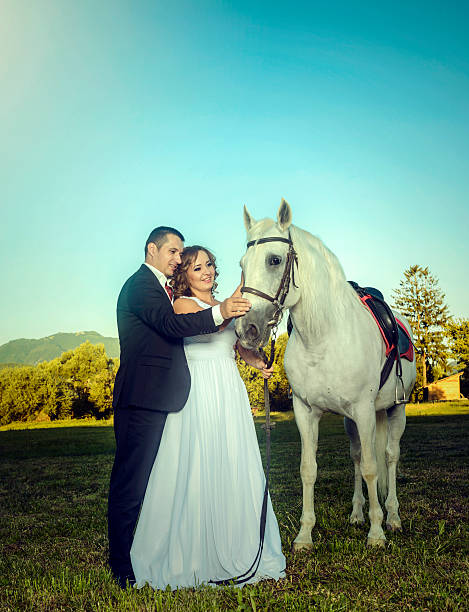 istock grooms loving horse 186683704