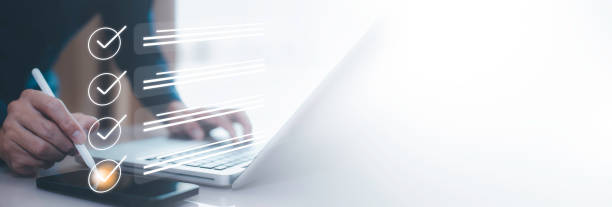 istock Checklist and clipboard task documentation management Online survey, form checklist by laptop computer, Document Management Checking System, online documentation database and process manage files. 1866837307