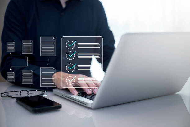istock Checklist and clipboard task documentation management Online survey, form checklist by laptop computer, Document Management Checking System, online documentation database and process manage files. 1866837851