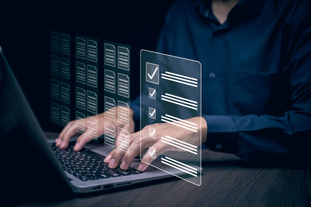 istock Checklist and clipboard task documentation management Online survey, form checklist by laptop computer, Document Management Checking System, online documentation database and process manage files. 1866839366