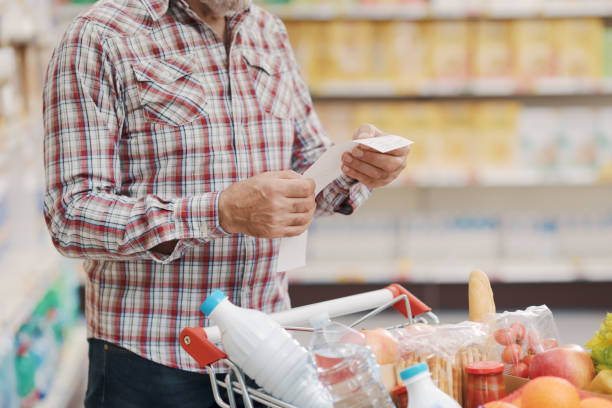 istock Customer checking the grocery receipt at the supermarket 1866842657