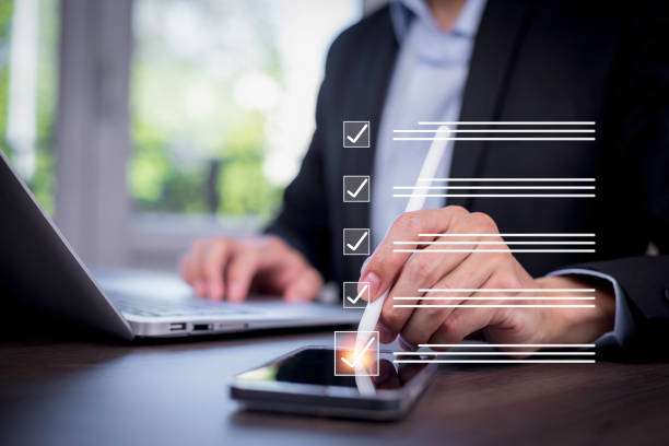 istock Checklist and clipboard task documentation management Online survey, form checklist by laptop computer, Document Management Checking System, online documentation database and process manage files. 1866844260