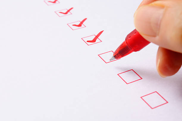 istock Writing a red check mark with ball point pen 186684566