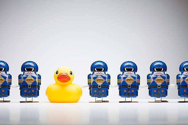 istock Standing out from the crowd - Tin Robot Rubber Duck 186684640