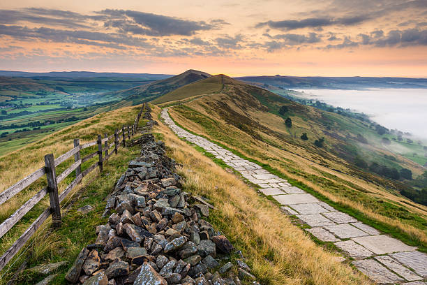 Mam Tor Mist, Peak District National Park Wide angle view looking along the Mam Tor footpath in the Peak District National Park. peak district national park photos stock pictures, royalty-free photos & images