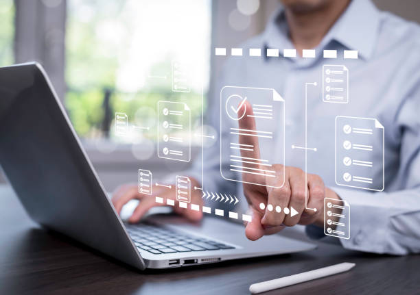 istock Online survey filling out and digital form checklist by laptop computer, Document Management Checking System, online documentation database and process manage files. 1866855354