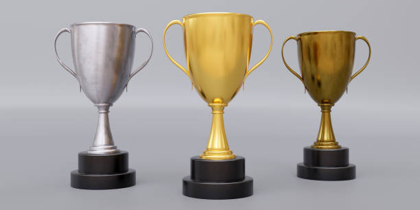istock Gold silver bronze trophy cup with dual handle on grey background. Shiny metallic reward. 3d render 1866862757