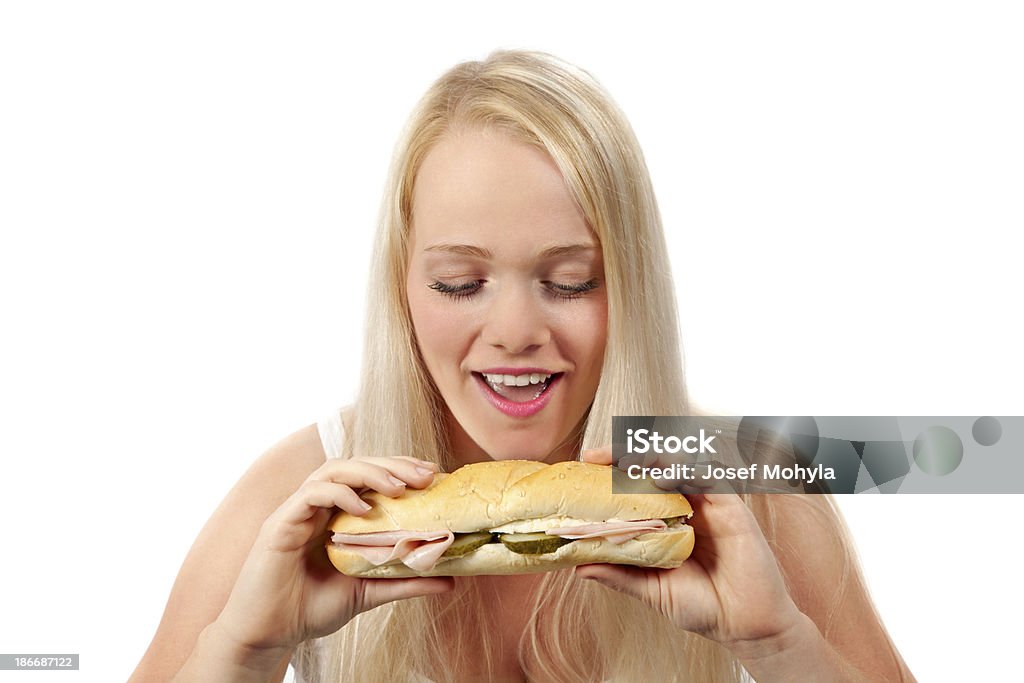 Jovem mulher comendo Sanduíche - Foto de stock de Comer royalty-free