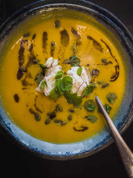 istock pumpkin cream soup in a bowl with a spoon 1866872025