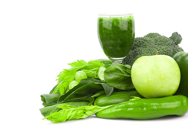 istock Green juice and Vegetable variety isolated on white background 186687398