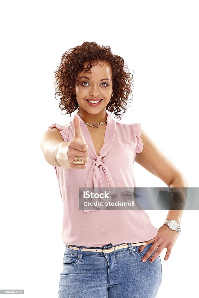 Young woman showing you thumbs up sign Portrait of young woman showing you thumbs up sign against white background 20-24 Years Stock Photo