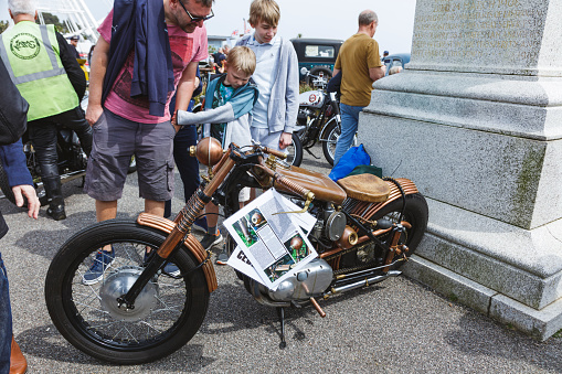 Custom bobber motorbike. Vintage style motorcycle standing on the road.